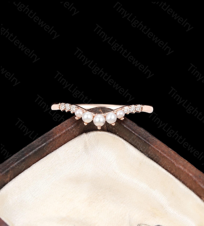 a close up of a ring in a box