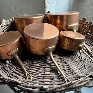 Gorgeous Set of 5 Vintage French Copper Saucepans by Metaux Ouvres, good condition, left unpolished for buyer as some like this patina.