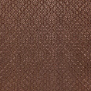May include: A close-up of a brown fabric with a repeating geometric pattern. The pattern consists of diamond shapes with an ornate design inside each diamond. The fabric has a textured appearance and a warm, earthy tone.