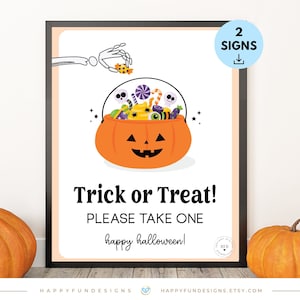 May include: Printable Halloween sign with a black frame, featuring a cartoon pumpkin bucket filled with candy and the text "Trick or Treat! Please take one happy halloween!"