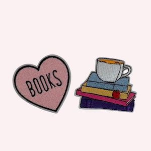 May include: Two embroidered patches: a pink heart with the word "BOOKS" and a stack of books topped with a teacup. The books are in various colors, including blue, yellow, pink, and purple. The teacup is white with a brown liquid inside.