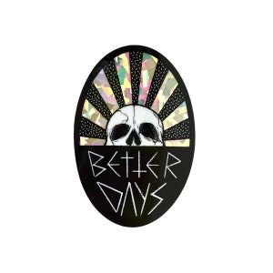 May include: Black and white sticker with a skull and the text "BETTER DAYS" in a stylized font. The skull is partially obscured by a holographic sunburst design.