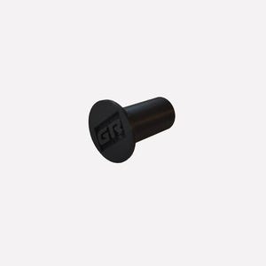 May include: A black cylindrical component with a circular head. The head has the embossed letters "GR". This small object could be a fastener or a part of a larger assembly, such as furniture or machinery.