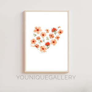 May include: A printable art print featuring a watercolor illustration of a heart shape made of peach and orange flowers with red centers. The flowers are arranged in a heart shape on a white background.