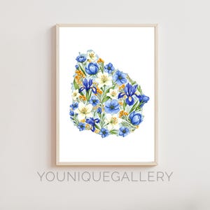 May include: A watercolor painting of the outline of Uruguay filled with blue, white, and yellow flowers. The flowers are arranged in a dense, organic pattern, creating a beautiful and intricate design.