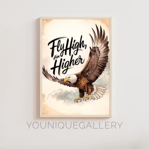 May include: A watercolour illustration of a bald eagle with wings spread, flying against a light brown background with clouds. The eagle is brown and white with a yellow beak. The text "Fly High, Aim Higher" is written in black cursive lettering.