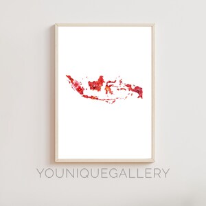 May include: A white framed print of a floral map of Indonesia. The map is made of red and pink flowers.