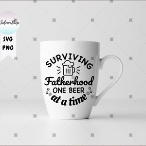 May include: White ceramic mug with a black design that says "Surviving Fatherhood One Beer at a Time" with a beer mug icon.