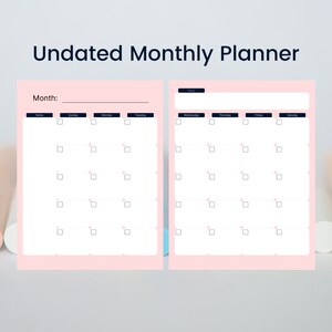 May include: A pink undated monthly planner with a white background. The planner has two pages with a calendar layout. The top of the planner reads "Undated Monthly Planner". The left page has the word "Month:" and the days of the week. The right page has the days of the week.