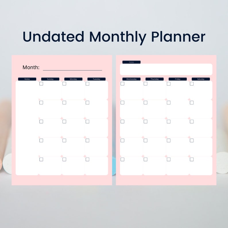 May include: A pink undated monthly planner with a white background. The planner has two pages with a calendar layout. The top of the planner reads "Undated Monthly Planner". The left page has the word "Month:" and the days of the week. The right page has the days of the week.