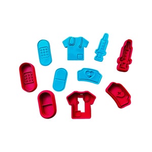 May include: A set of ten blue and red plastic cookie cutters shaped like medical items, including a stethoscope, a syringe, a bandage, and a pill.