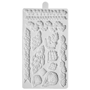 May include: White silicone mold with various designs of beaded borders and leaves. The mold is designed for creating decorative sugar paste or fondant embellishments for cakes and other desserts.