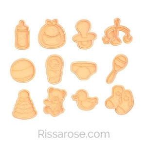 May include: A collection of light orange cookie cutters in various baby-themed shapes, including a bottle, baby in a blanket, pacifier, mobile, ball, baby, diaper, rattle, stacking rings, teddy bear, duck, and socks. The website address "Rissarose.com" is at the bottom.