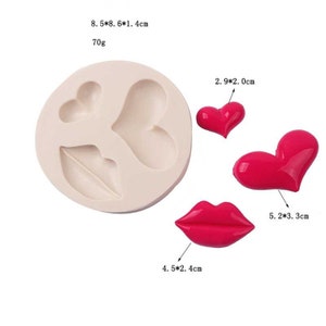 May include: Silicone mold for making heart and lip shapes. The mold is 8.5 inches by 8.6 inches and 1.4 inches deep. The mold is shown with three finished heart and lip shapes, measuring 2.9 cm by 2.0 cm, 5.2 cm by 3.3 cm, and 4.5 cm by 2.4 cm.