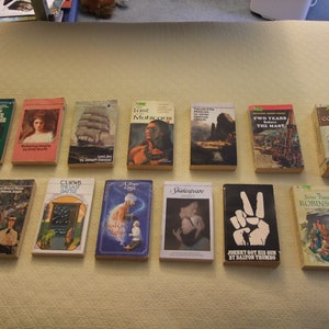 May include: A collection of 13 paperback books with various titles, including "When the Legends Die", "The Last Mohicans", "Two Years Before the Mast", and "David Copperfield".