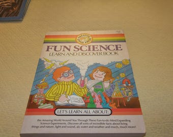 May include: A colorful book cover with the title "Fun Science: Learn and Discover Book". The cover features illustrations of two children doing science experiments. The book is part of the "Creative Child Press" series.