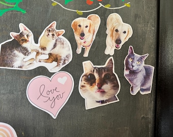 May include: A collection of pet stickers featuring a cat, a dog, and a heart with the text "Love you".