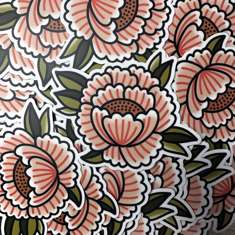 May include: A sheet of stickers featuring pink and white peonies with green leaves. The stickers are arranged in a random pattern.