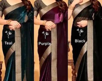May include: Three elegant sarees in teal, purple, and black. Each saree features a shimmering fabric with a contrasting gold border and a matching patterned blouse. The word "Teal", "Purple", and "Black" are printed on the sarees.