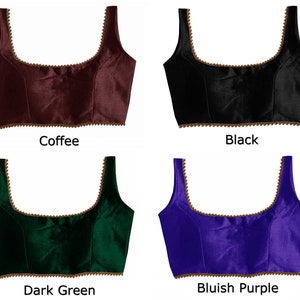 May include: Four different colored satin blouses with a gold trim. The colors are coffee, black, dark green, and bluish purple.