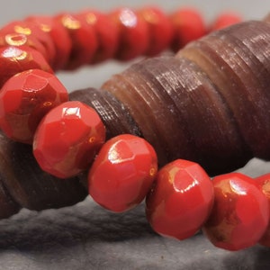 10 Bohemian glass beads 5 x 7 mm - fire-polished rondelle - coral red with shine / bronze finish - opaque - faceted - Czech beads