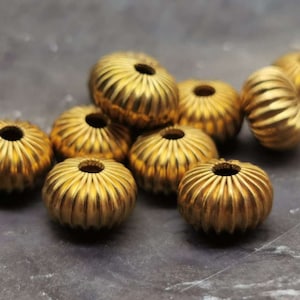 8 grooved rondelles 10 x 6 mm - gold-colored - alloy - hollow - spacer - ethnic - spacer beads - large hole - M_40