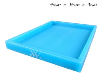 May include: A bright blue rectangular tray, 16 inches long, 12 inches wide, and 1.2 inches deep. The tray has a raised edge and a logo in the corner. The dimensions are also listed in centimeters: 41cm x 31cm x 3cm.