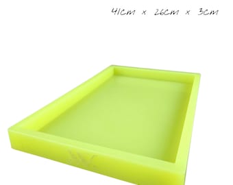 May include: A rectangular, neon yellow tray, measuring 16 inches long, 10 inches wide, and 1.2 inches deep. The tray has a raised edge and a smooth surface. The dimensions are also listed in centimeters: 41cm x 26cm x 3cm.