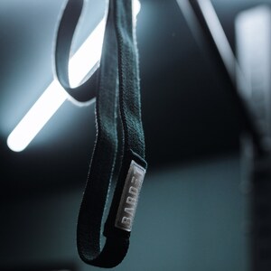 Resistance Band (long, heavy, fabric, black). Fitness equipment for home workouts & gym
