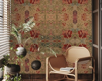 May include: A room with a floral patterned wallpaper, three potted plants, and a wicker chair. The chair has a book on the seat.