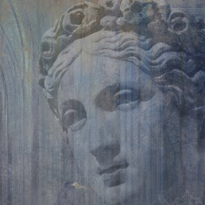 May include: A close-up of a weathered, blue-toned sculpture of a woman's face. The sculpture is partially obscured by a textured, blue background.