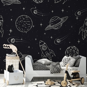 Senti la profondità dello spazio: carta da parati spaziale per bambini con pianeti e meteore, disegno lineare in bianco e nero, stacca e attacca, opzione vinile disponibile