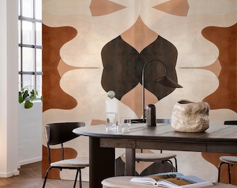 May include: A dining room scene featuring a large, abstract patterned rug in shades of brown, beige, and white. A dark wood dining table is set with a water bottle, glasses, and a decorative vase. Black chairs and a small wooden stool complete the setting.