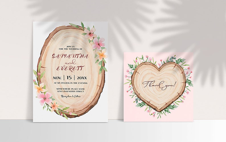 May include: Wedding invitation and thank you card set featuring a wood slice design. The invitation shows a wood slice with a floral wreath and the text "Join us for the wedding of Samantha and Everett, Nov. | 15 | 20XX, at six o'clock in the evening, Somewhere Place Name, 1234 Linsengton Street, Reception to follow". The thank you card features a heart-shaped wood slice with a floral wreath and the text "Thank you!"