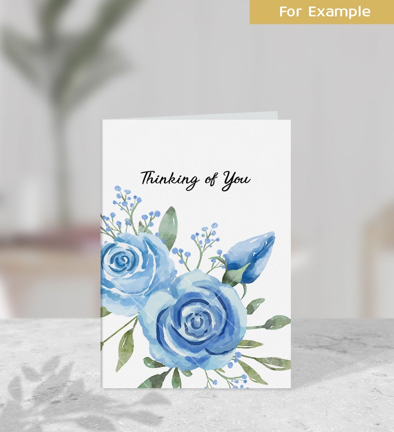 May include: A white card with the text "Thinking of You" in black script. The card is decorated with a watercolor illustration of blue roses and green leaves.