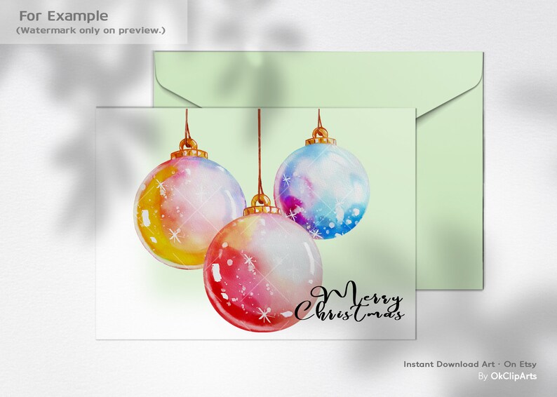 Puede incluir: Una ilustraci&oacute;n de acuarela de tres bolas de Navidad colgando de cuerdas. Las bolas est&aacute;n pintadas en tonos de rosa, azul, amarillo y blanco. El texto "Feliz Navidad" est&aacute; escrito en cursiva negra debajo de las bolas.