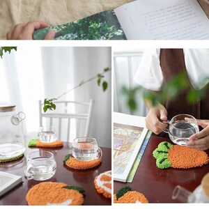 May include: Two sets of colorful crocheted coasters, one set is lime green and white and the other is orange and green. The coasters are shaped like fruit, one is a lime and the other is an orange. The coasters are on a wooden table with a glass of water on top of each coaster.