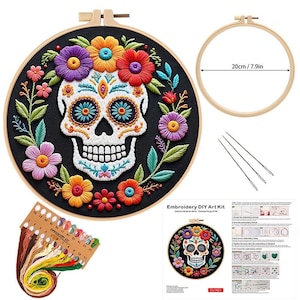 May include: Embroidery DIY art kit featuring a Day of the Dead skull design. The kit includes a black fabric hoop with a colorful floral skull, embroidery floss, needles, and a 7.9-inch (20 cm) wooden hoop.