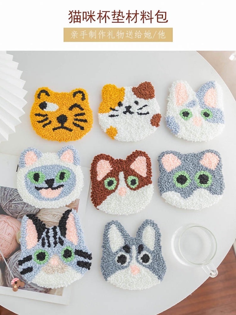 May include: Nine colorful felt cat-shaped DIY punch needle kits. Each kit features a different cat design with various colors and patterns. The kits are perfect for crafting and creating unique home decor.