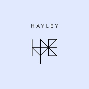 May include: A black and white geometric logo design with the word "HAYLEY" above it.