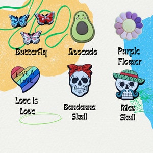May include: A set of colorful shoe charms featuring a rainbow heart with the text "Love is Love", a green avocado with a smiling face, a purple flower, a butterfly, a bandana skull, and a Mexican skull.