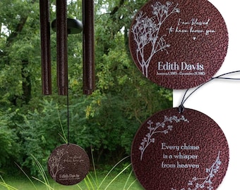 May include: A wind chime with dark brown textured metal tubes and a circular pendant featuring the text I am blessed to have known you, Edith Davis, January 1, 1885 - December 31, 1985, and Every chime is a whisper from heaven with floral art.
