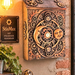 May include: A rectangular wall-mounted clock featuring a bronze-toned finish with an intricate arrangement of exposed gears, a crescent moon, and a sun face. The center displays a small circular clock face with black hands and Roman numerals.