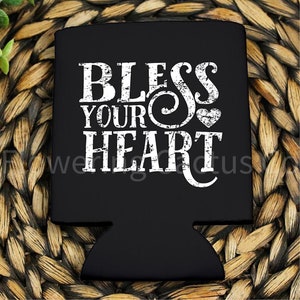 May include: Black and white can cooler with the text "Bless Your Heart" in a distressed font. A small heart is included in the design.