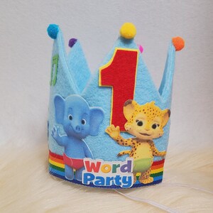 May include: Blue felt crown with a red number one, a blue elephant and a yellow cheetah, with the words "Word Party" on the bottom.