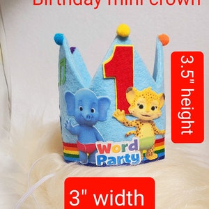 May include: Blue felt birthday crown with a number one, a rainbow stripe, and the words "Word Party". The crown is 3 inches wide and 3.5 inches tall.