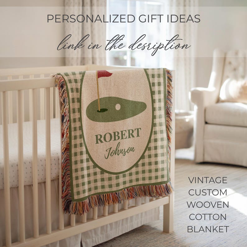 May include: A personalized cotton blanket with a golf course design, displayed on a crib. The blanket features a green and white gingham pattern with a central oval design showing a golf green, flag, and the name "Robert Johnson". The text "PERSONALIZED GIFT IDEAS" and "link in the description" are also visible.