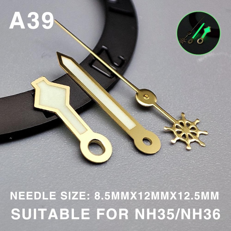 May include: Close-up of watch hands in gold and white. The hands include a diamond-shaped hour hand, a long minute hand, and a second hand shaped like a ship's wheel. The text "A39" is visible. The text "NEEDLE SIZE: 8.5MMX12MMX12.5MM SUITABLE FOR NH35/NH36" is also visible.