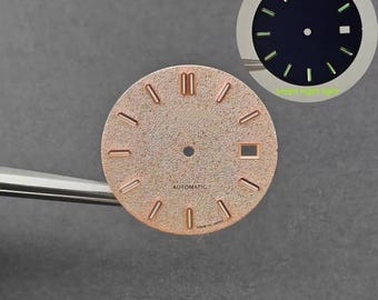 31mm rose gold sandblasted dial for the NH35/NH36 movement, with green luminous raised hour markers and custom-modified components