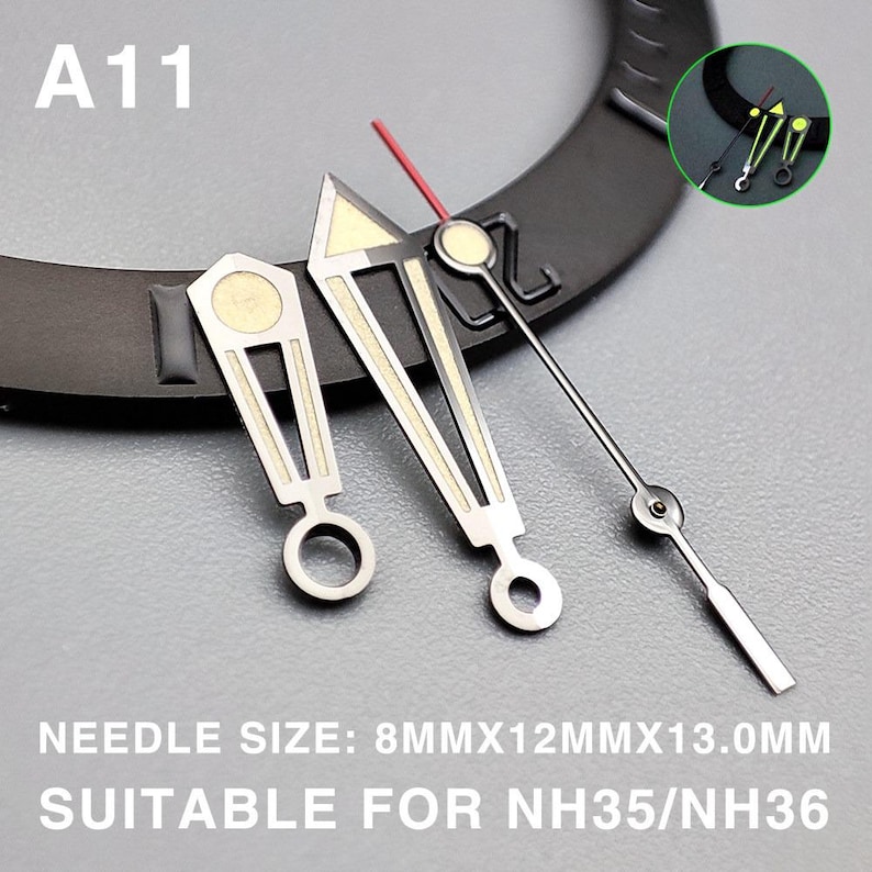 May include: Watch hands set with silver and gold accents, including a red second hand. The text "A11" is visible. The text "NEEDLE SIZE: 8MMX12MMX13.0MM SUITABLE FOR NH35/NH36" is also visible.